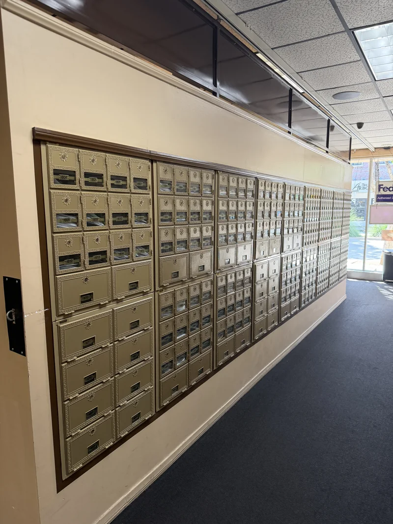 A wall of private locking mailboxes inside Mailbox Planet in Pasadena